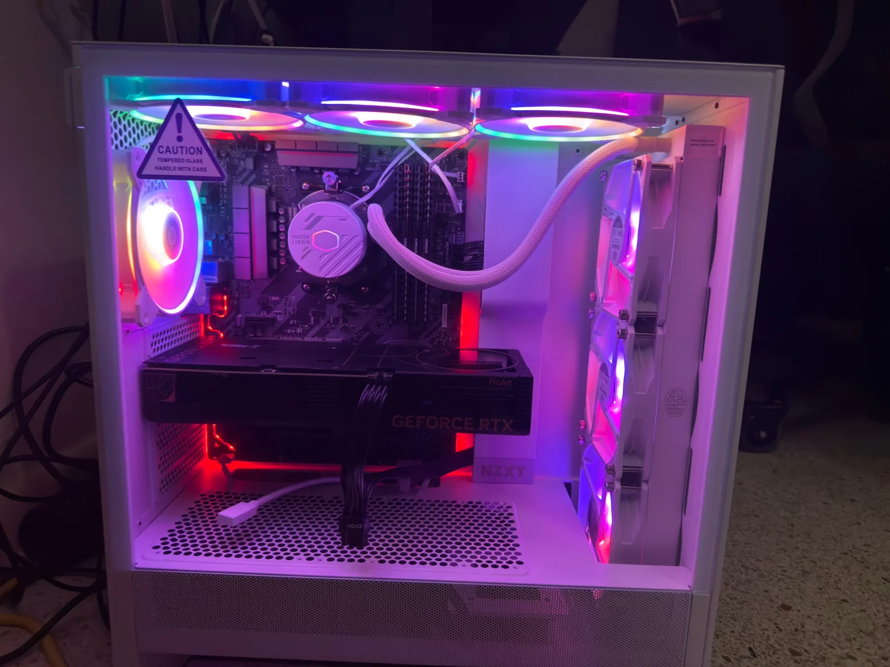 The same desktop PC lit in pink and magenta