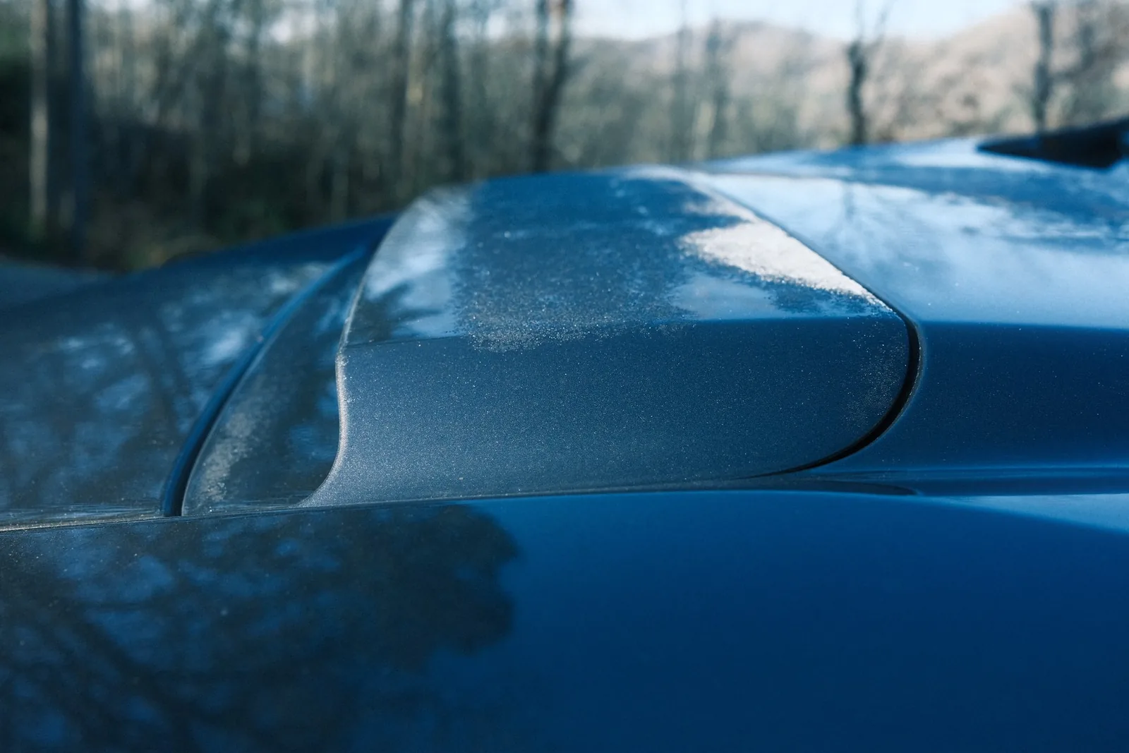 Close-up of the WRX hood scoop dusted with morning frost